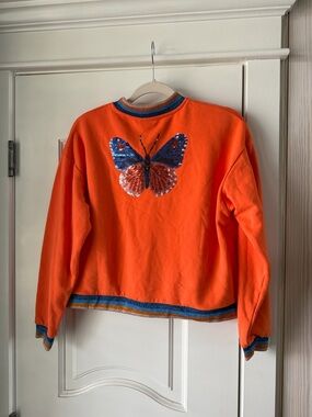 Queen of Sparkles Orange Sweatshirt with Sequin Butterfly